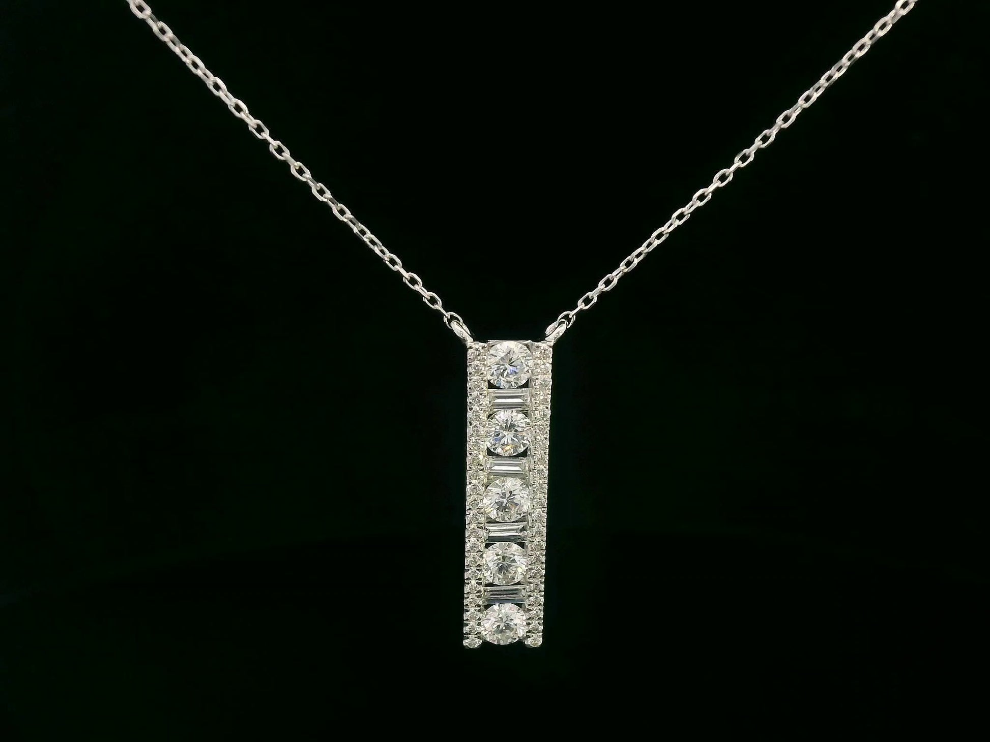 18K white gold diamond bar pendant with round and baguette-cut diamonds — 0.86ct Emirates Diamonds.
