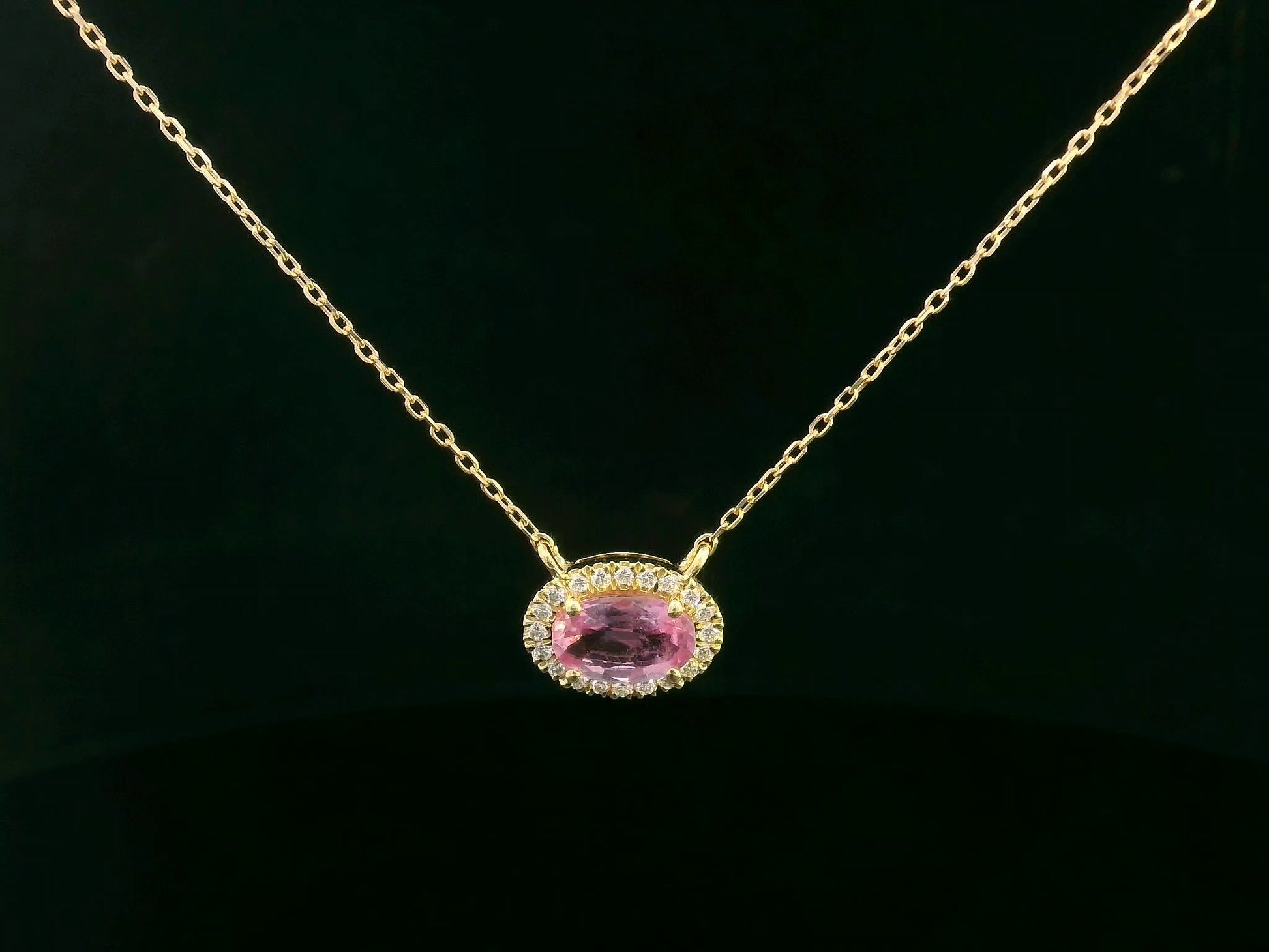 18K yellow gold pink sapphire and diamond halo necklace – 0.75ct sapphire with 0.10ct diamonds by Emirates Diamonds