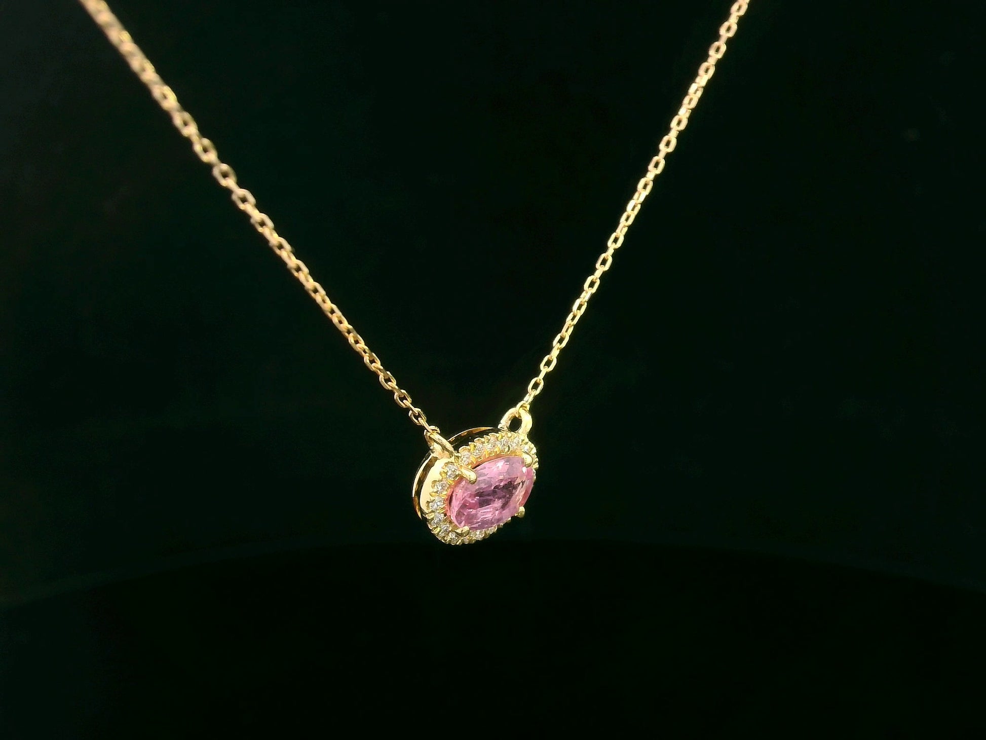 18K yellow gold pink sapphire and diamond halo necklace – 0.75ct sapphire with 0.10ct diamonds by Emirates Diamonds