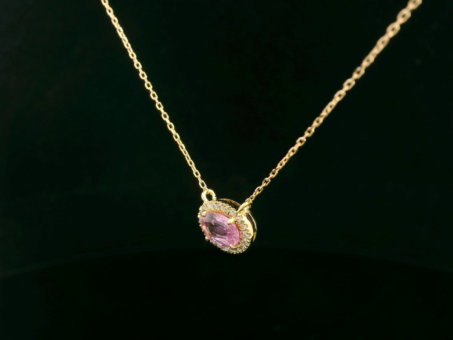 18K yellow gold pink sapphire and diamond halo necklace – 0.75ct sapphire with 0.10ct diamonds by Emirates Diamonds
