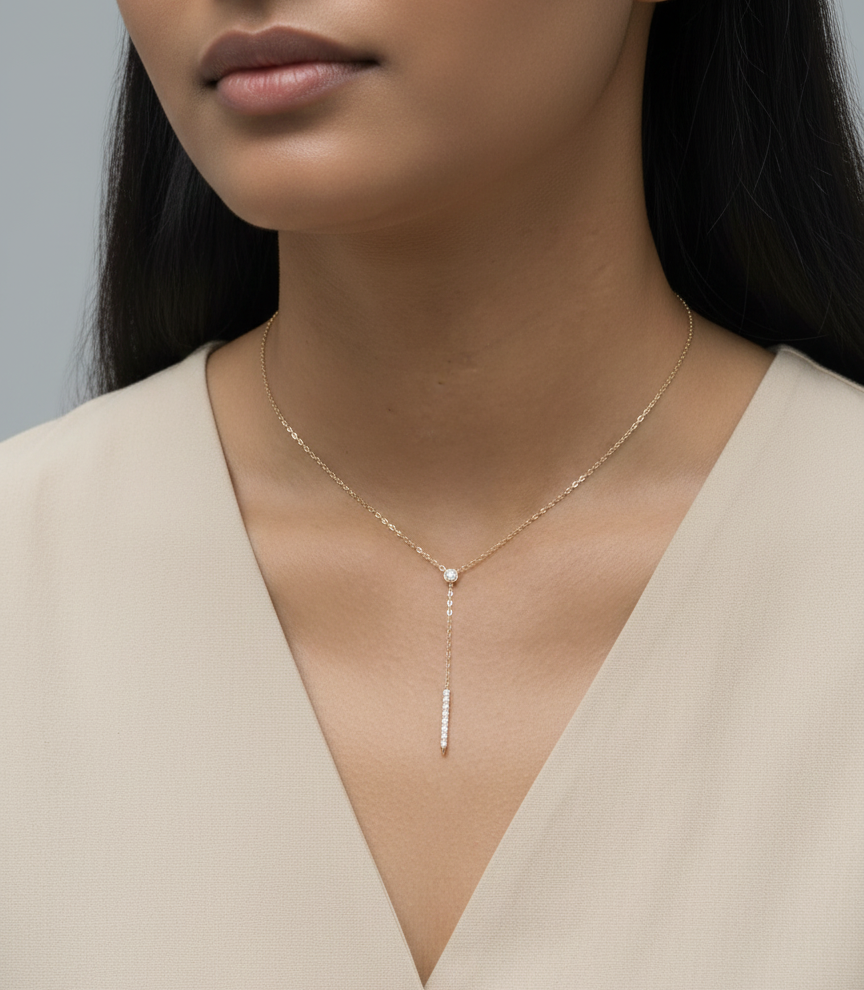 18K yellow gold diamond lariat necklace with bezel-set diamond and pavé drop – Emirates Diamonds.