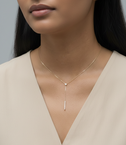 18K yellow gold diamond lariat necklace with bezel-set diamond and pavé drop – Emirates Diamonds.