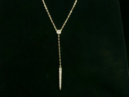 18K yellow gold diamond lariat necklace with bezel-set diamond and pavé drop – Emirates Diamonds.