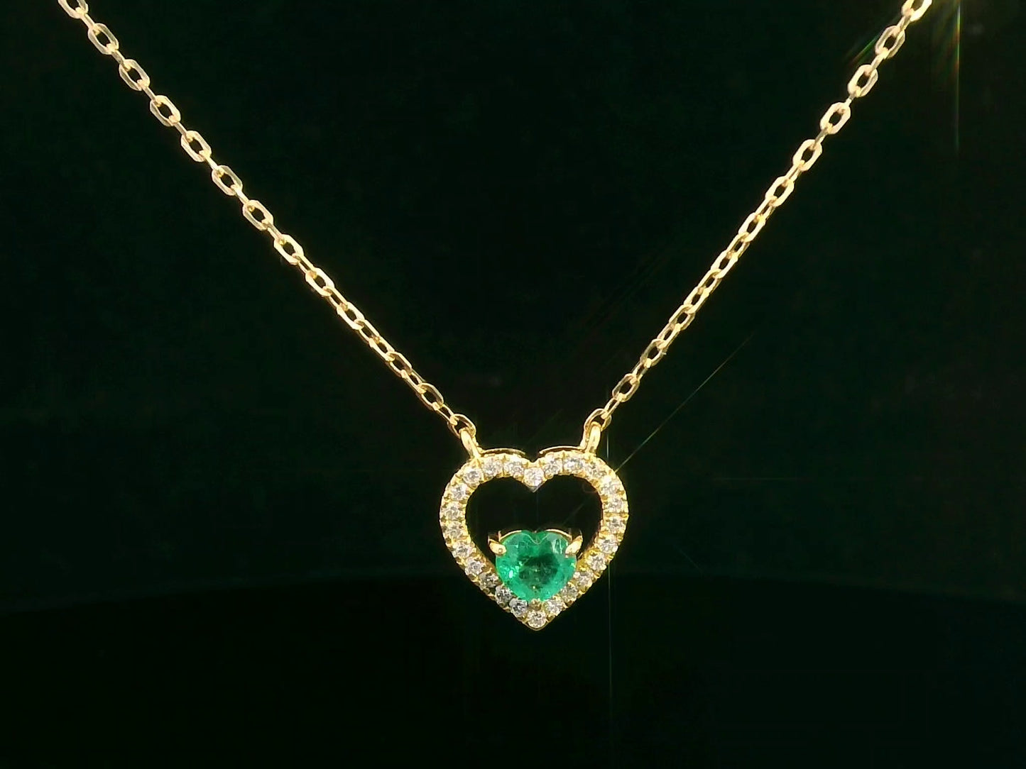 18K yellow gold heart-shaped emerald necklace with diamond halo – fine jewelry by Emirates Diamonds