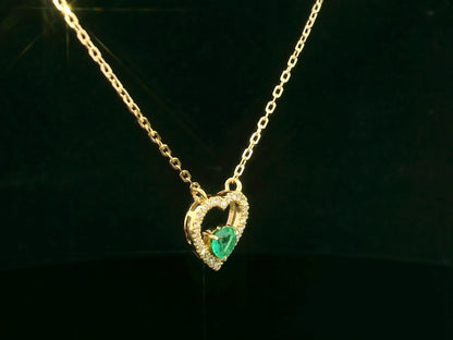 18K yellow gold heart-shaped emerald necklace with diamond halo – fine jewelry by Emirates Diamonds