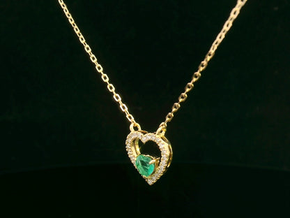 18K yellow gold heart-shaped emerald necklace with diamond halo – fine jewelry by Emirates Diamonds