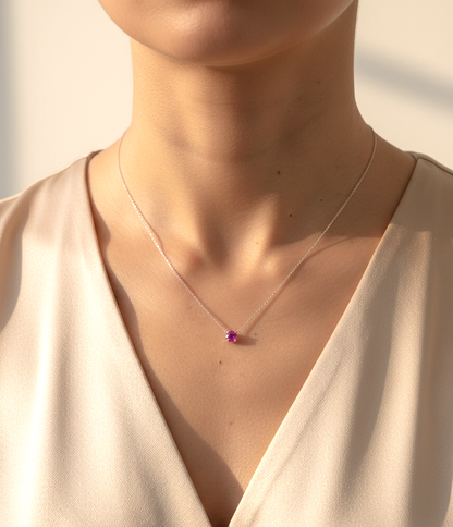 18K white gold pink sapphire solitaire necklace featuring a 0.61 carat round pink sapphire pendant by Emirates Diamonds
