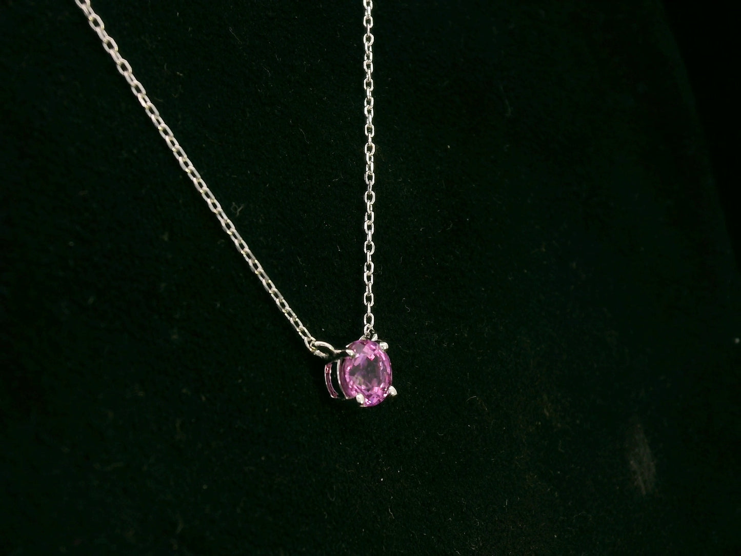 18K white gold pink sapphire solitaire necklace featuring a 0.61 carat round pink sapphire pendant by Emirates Diamonds