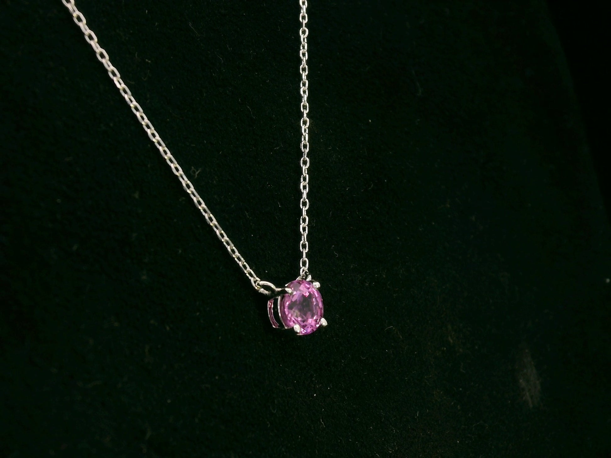 18K white gold pink sapphire solitaire necklace featuring a 0.61 carat round pink sapphire pendant by Emirates Diamonds