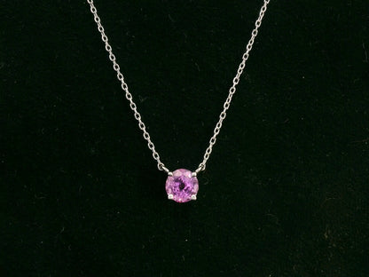 18K white gold pink sapphire solitaire necklace featuring a 0.61 carat round pink sapphire pendant by Emirates Diamonds