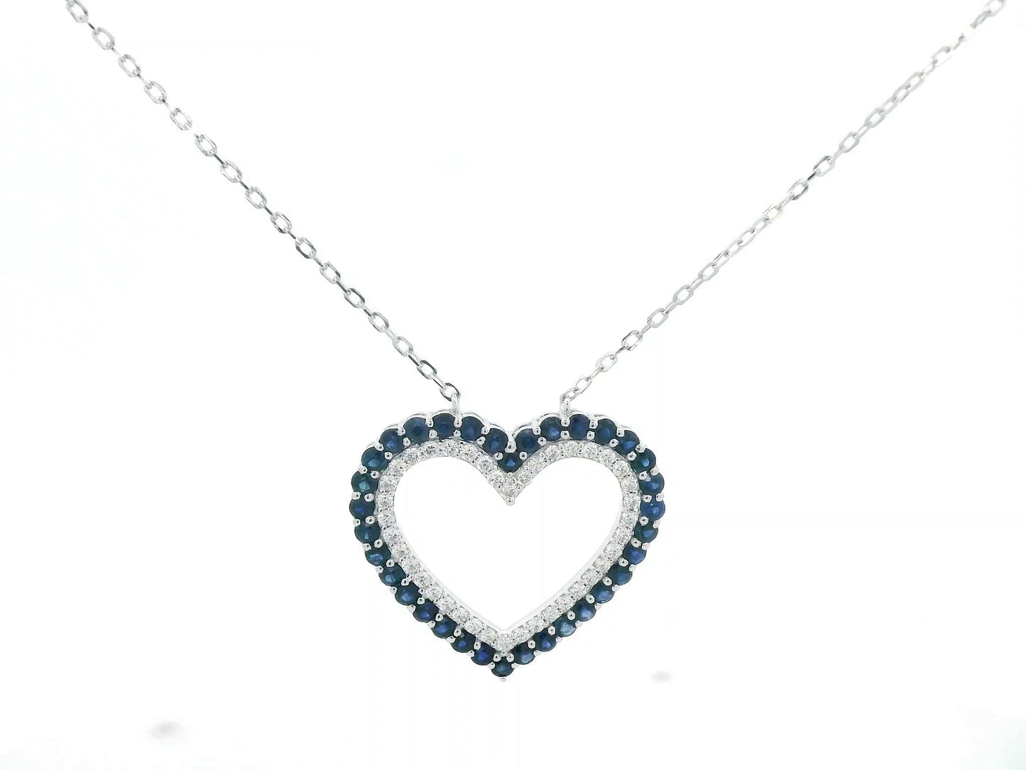 Blue sapphire and diamond heart pendant in 18K white gold, 1.23 ct sapphires, 0.37 ct diamonds, luxury fine jewelry by Emirates Diamonds