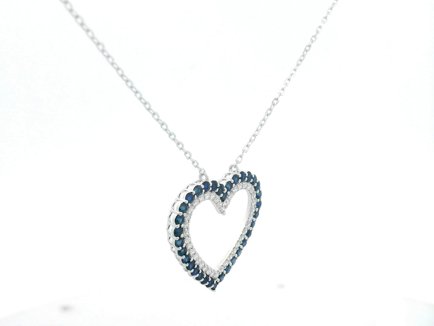Blue sapphire and diamond heart pendant in 18K white gold, 1.23 ct sapphires, 0.37 ct diamonds, luxury fine jewelry by Emirates Diamonds