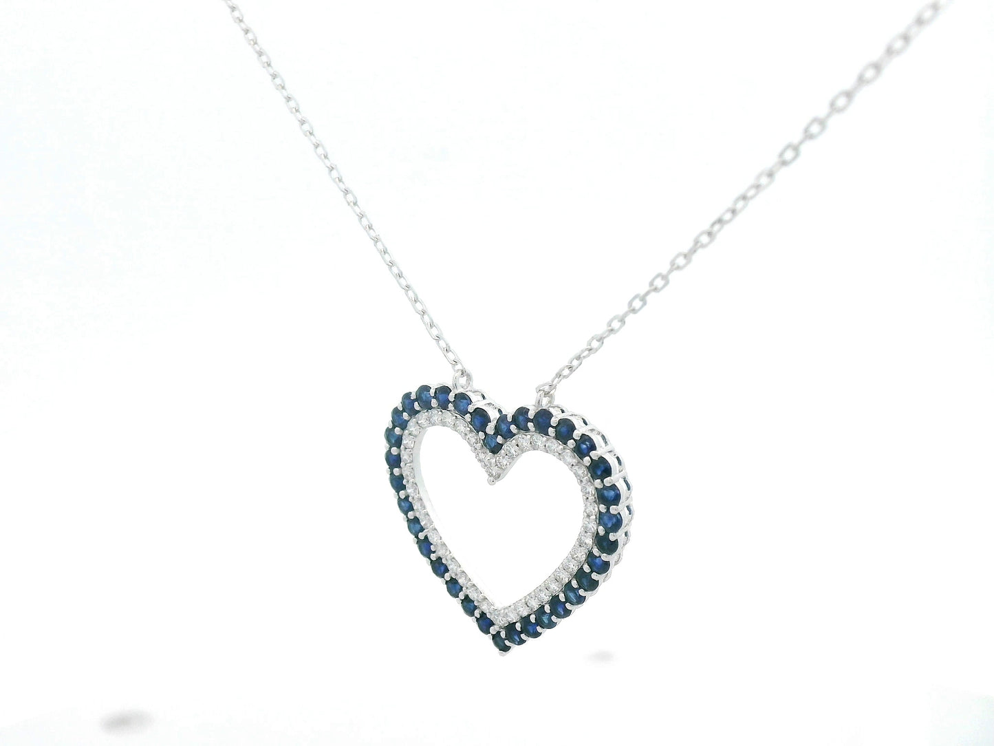 Blue sapphire and diamond heart pendant in 18K white gold, 1.23 ct sapphires, 0.37 ct diamonds, luxury fine jewelry by Emirates Diamonds