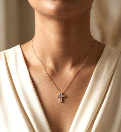 Multicolour sapphire and diamond cross necklace in 18K rose gold with colourful sapphires surrounded by round brilliant diamonds.