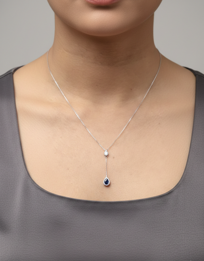 Blue sapphire and diamond drop necklace in 18K white gold pear-shaped sapphire with halo – Emirates Diamonds