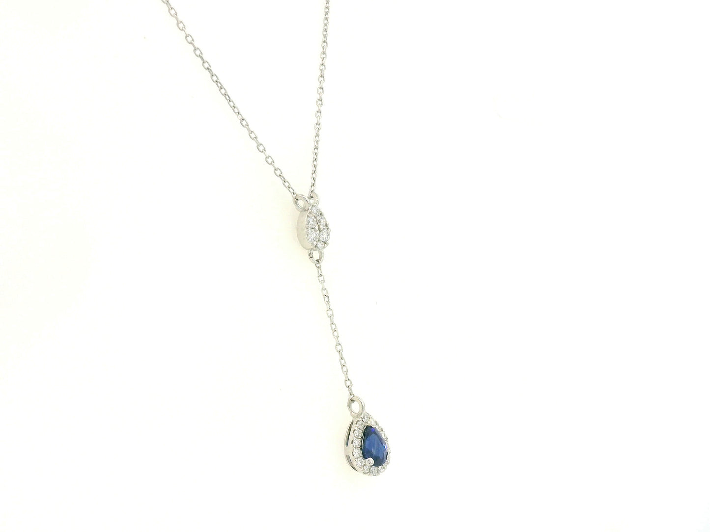 Blue sapphire and diamond drop necklace in 18K white gold pear-shaped sapphire with halo – Emirates Diamonds