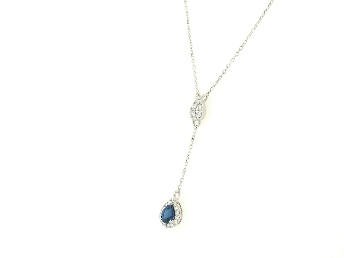 Blue sapphire and diamond drop necklace in 18K white gold pear-shaped sapphire with halo – Emirates Diamonds