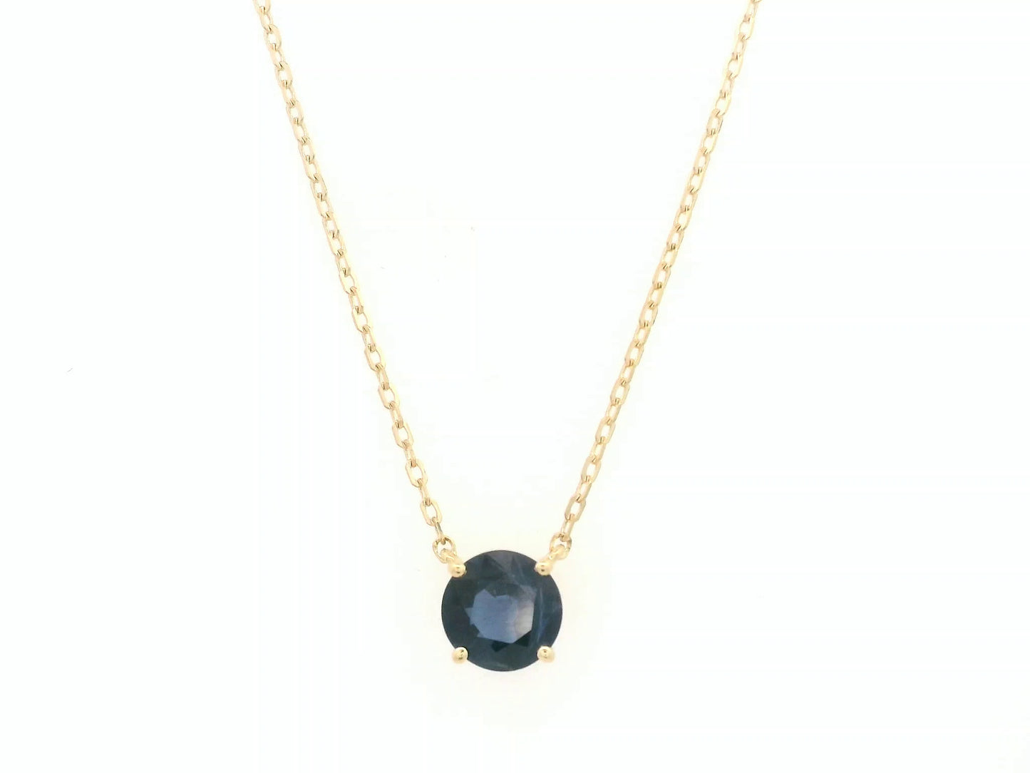 Round blue sapphire solitaire necklace in 18K yellow gold by Emirates Diamonds