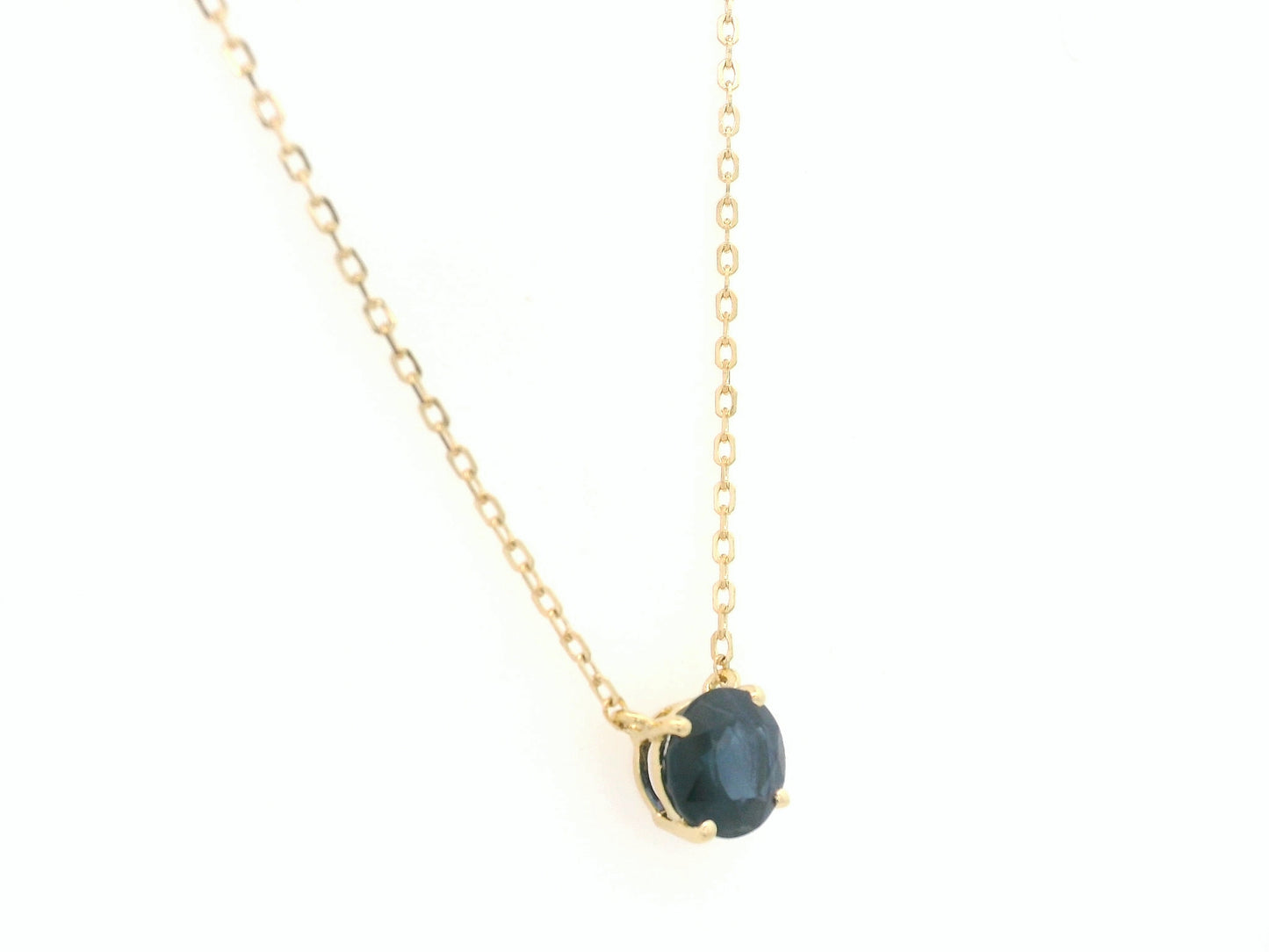 Round blue sapphire solitaire necklace in 18K yellow gold by Emirates Diamonds
