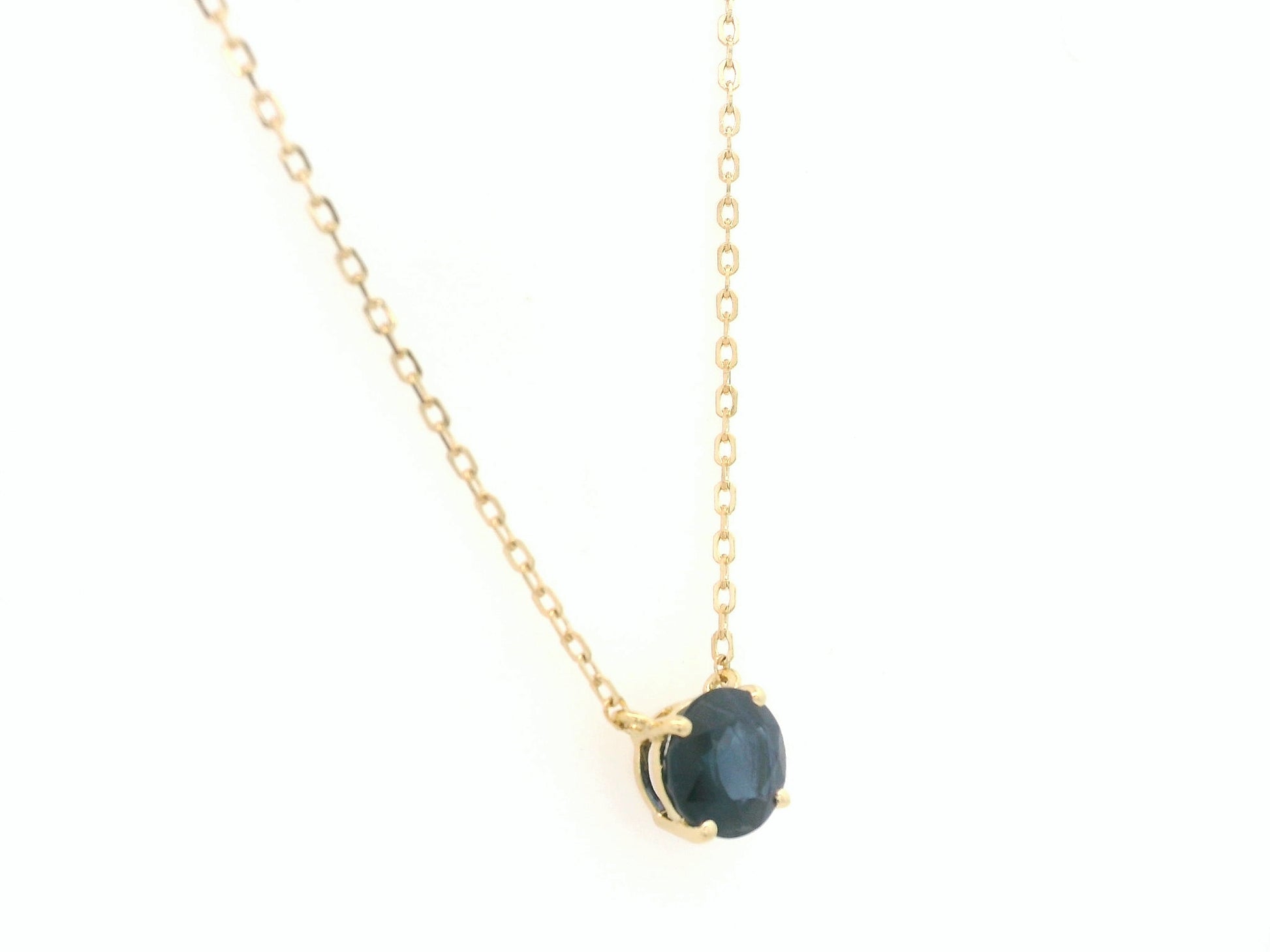 Round blue sapphire solitaire necklace in 18K yellow gold by Emirates Diamonds