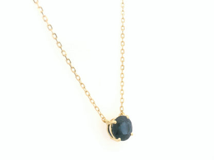Round blue sapphire solitaire necklace in 18K yellow gold by Emirates Diamonds