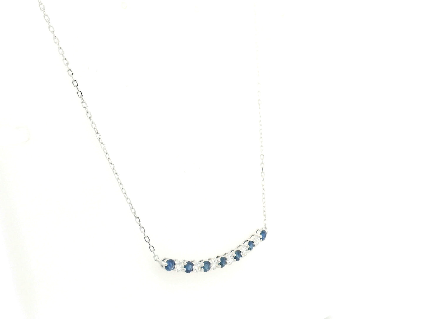 Blue sapphire and diamond bar necklace in 18K white gold featuring 0.74 carats of sapphires and 0.55 carats of diamonds by Emirates Diamonds.