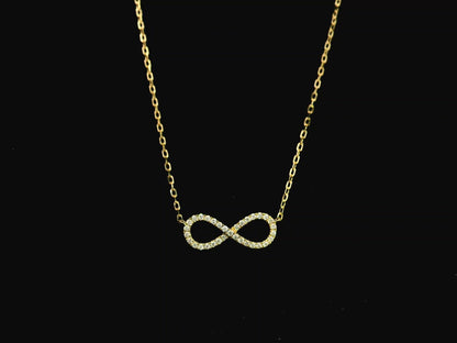 Diamond infinity necklace in 18K yellow gold featuring 0.19 carats of diamonds by Emirates Diamonds.