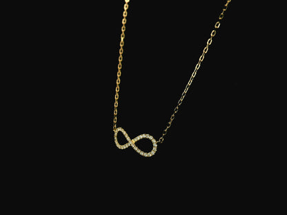 Diamond infinity necklace in 18K yellow gold featuring 0.19 carats of diamonds by Emirates Diamonds.