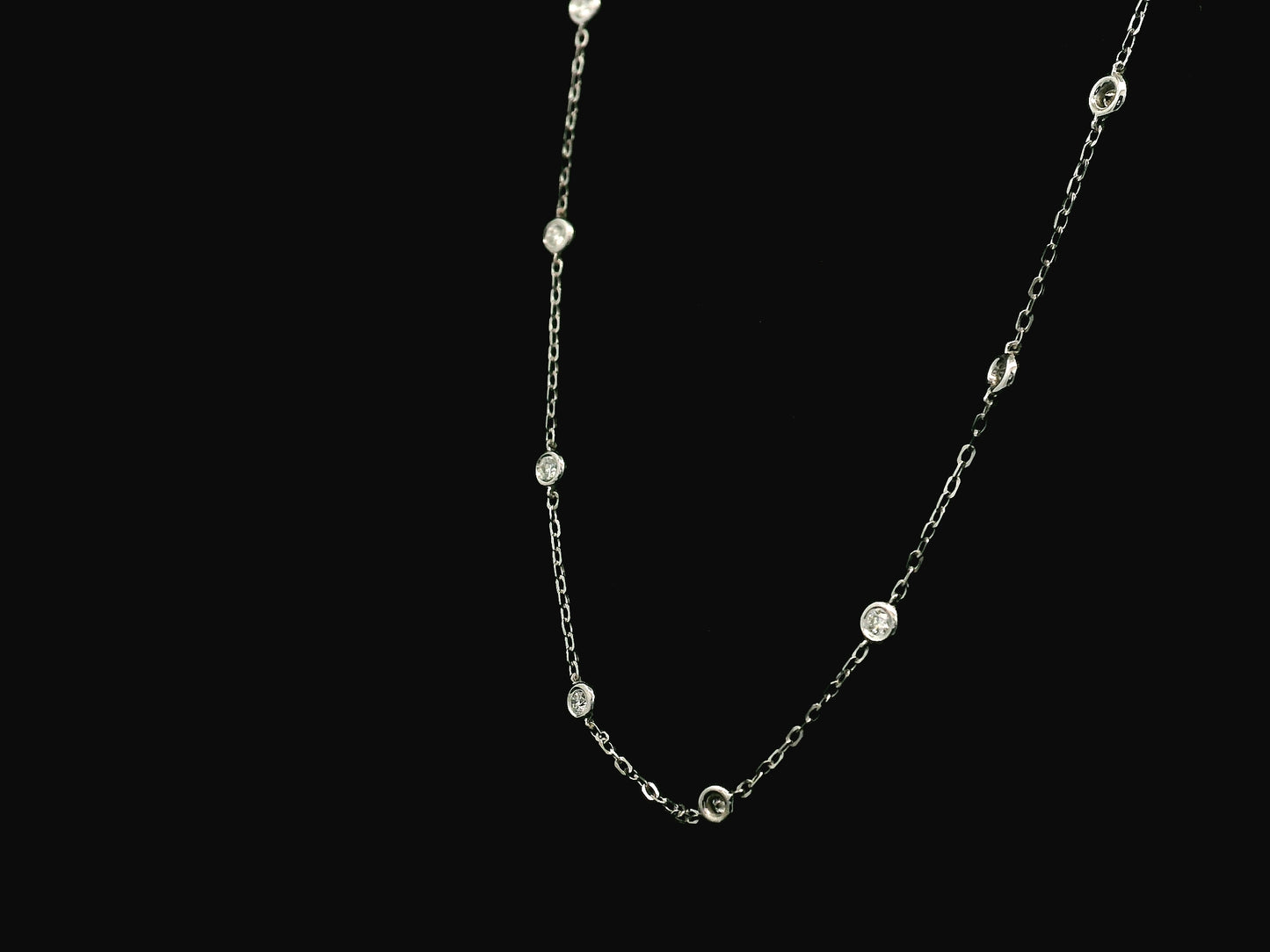 Diamond station necklace in 18K white gold with 0.60ct bezel-set diamonds – Emirates Diamonds