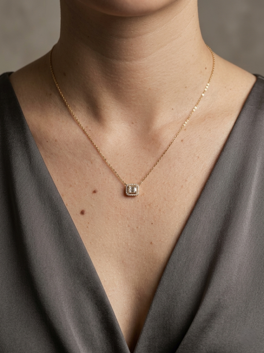 Baguette and round diamond halo pendant necklace in 18K yellow gold