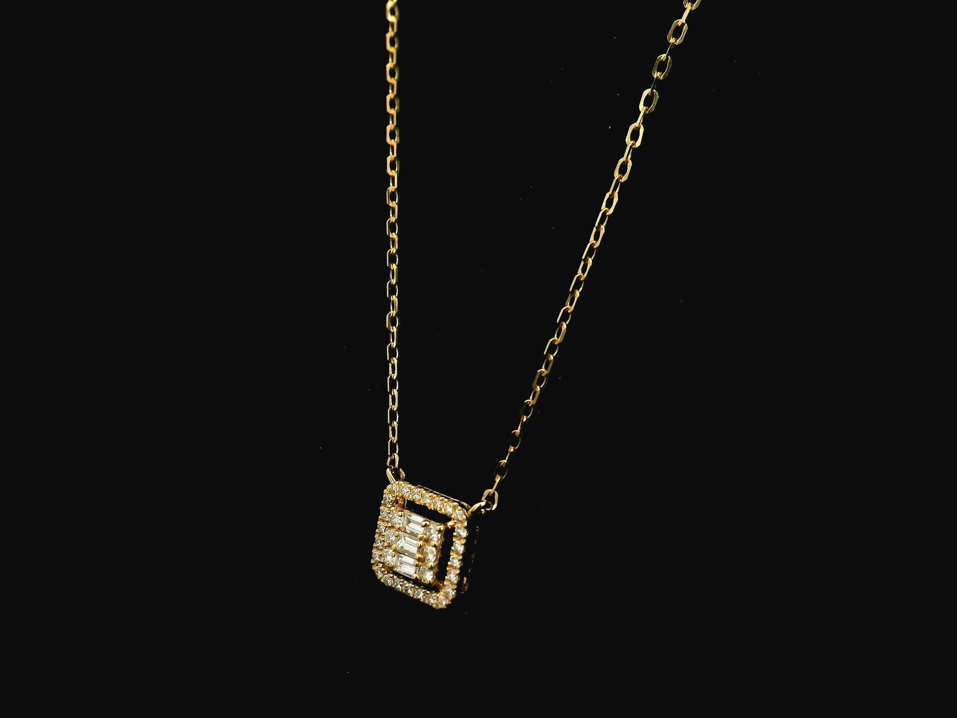 Baguette and round diamond halo pendant necklace in 18K yellow gold