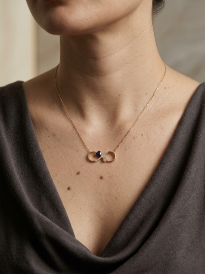 Blue sapphire diamond infinity heart necklace in 18K yellow gold