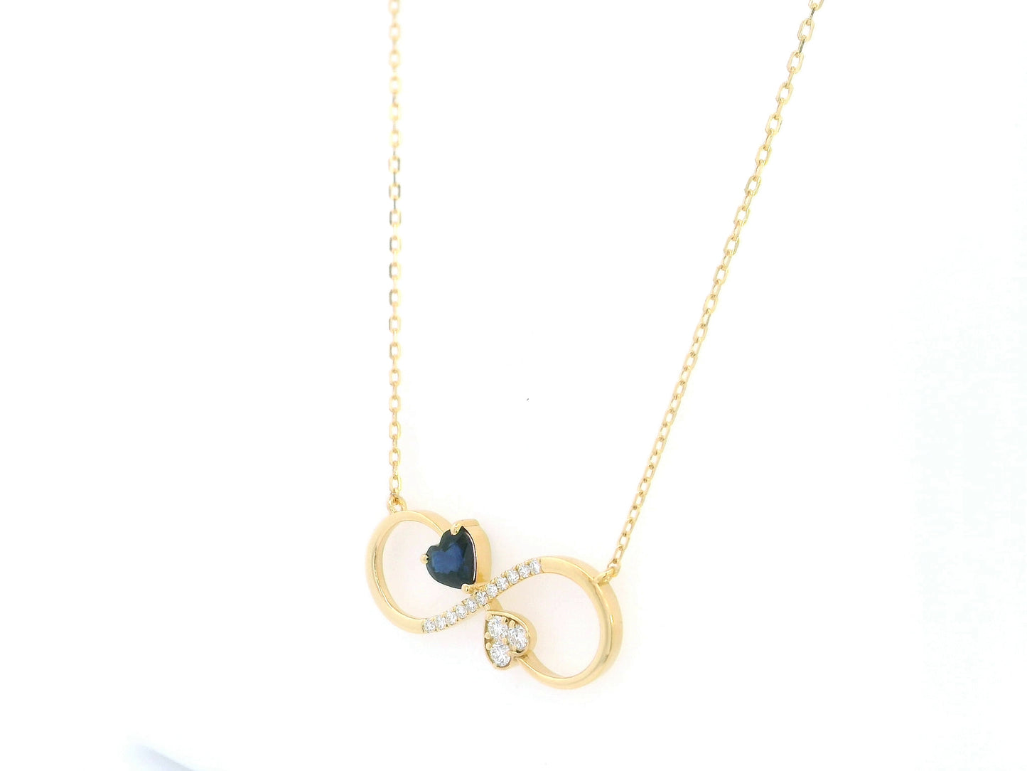 Blue sapphire diamond infinity heart necklace in 18K yellow gold
