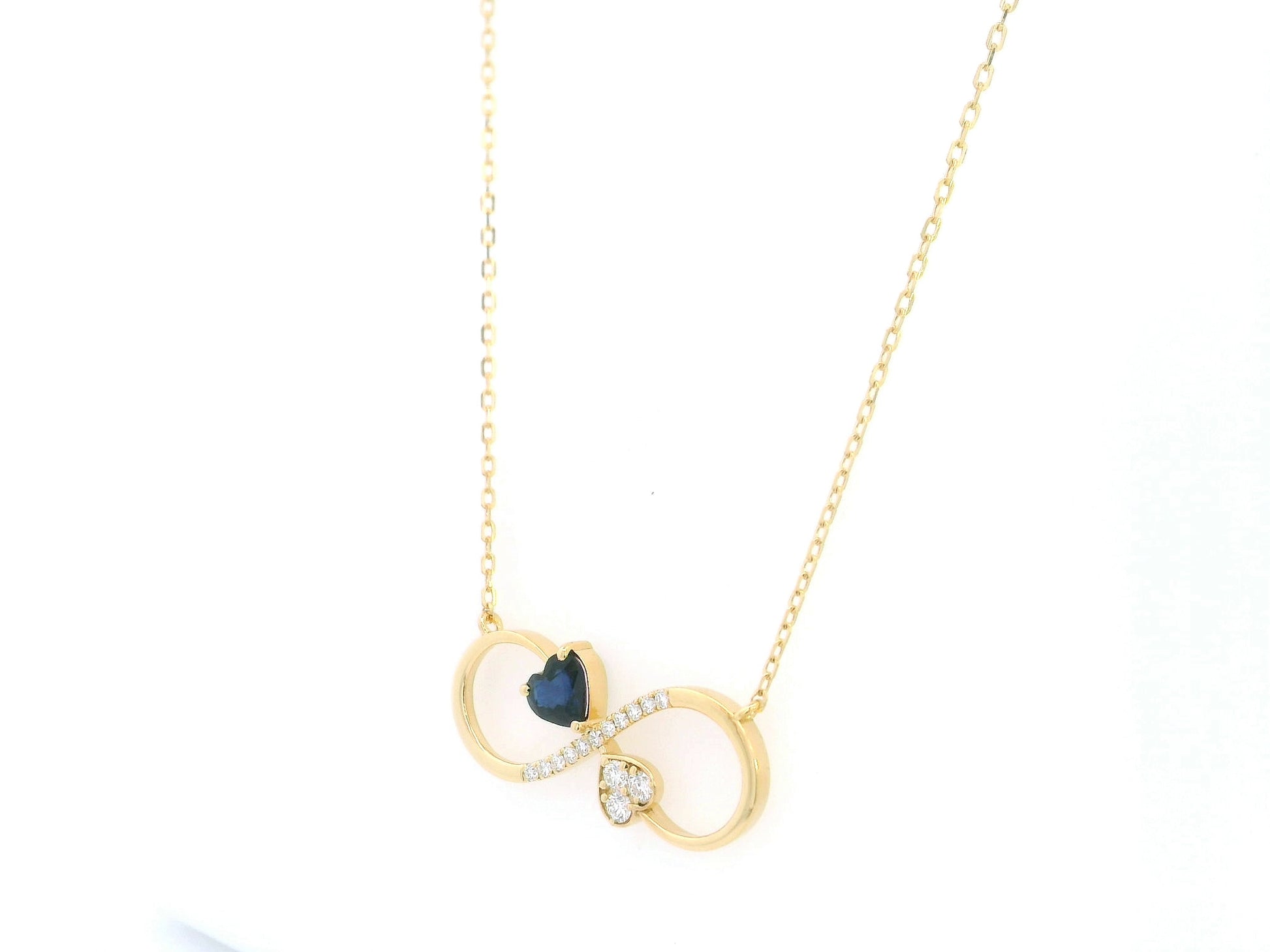 Blue sapphire diamond infinity heart necklace in 18K yellow gold