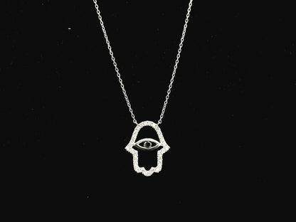Diamond Hamsa evil eye pendant necklace in 18K white gold with black diamond center by Emirates Diamonds