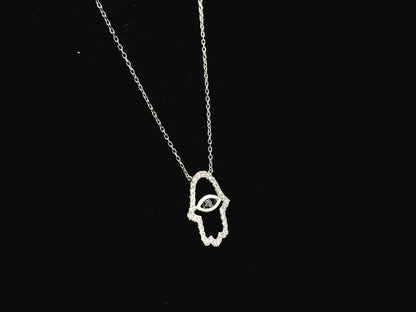 Diamond Hamsa evil eye pendant necklace in 18K white gold with black diamond center by Emirates Diamonds