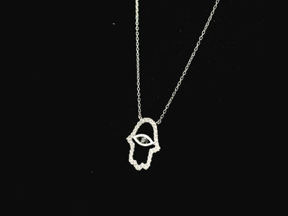 Diamond Hamsa evil eye pendant necklace in 18K white gold with black diamond center by Emirates Diamonds