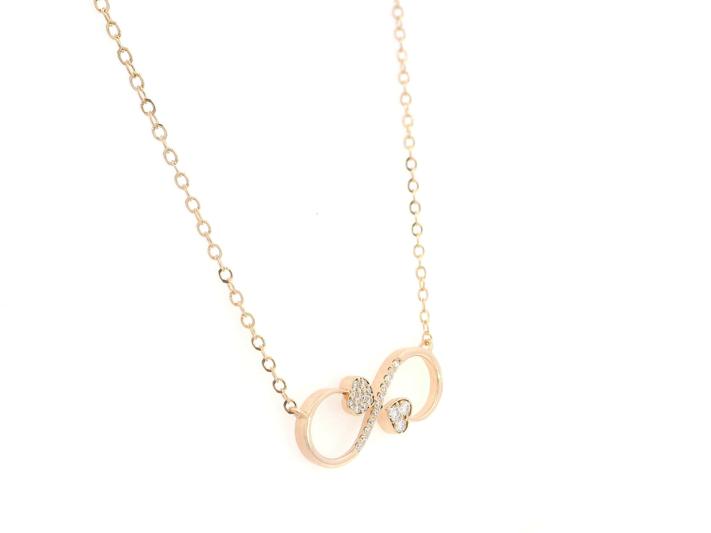18K rose gold infinity heart necklace with pavé diamonds and double heart design.