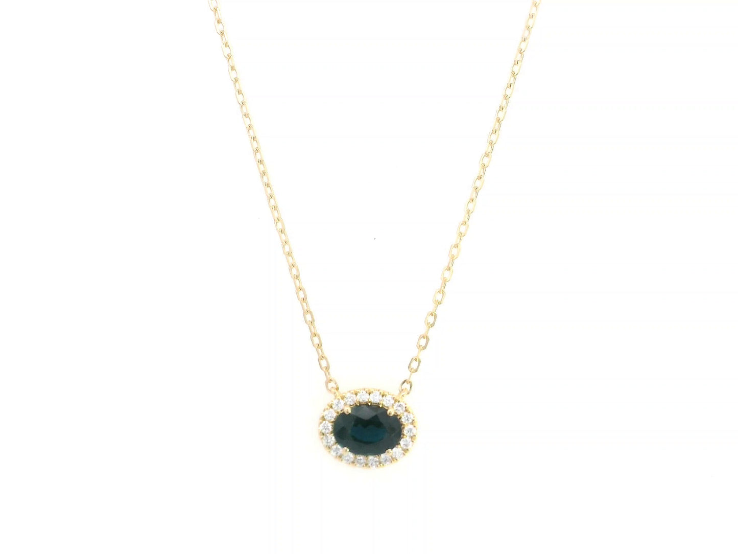 18K yellow gold sapphire and diamond halo pendant necklace with oval blue sapphire center stone