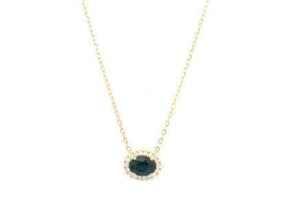 18K yellow gold sapphire and diamond halo pendant necklace with oval blue sapphire center stone