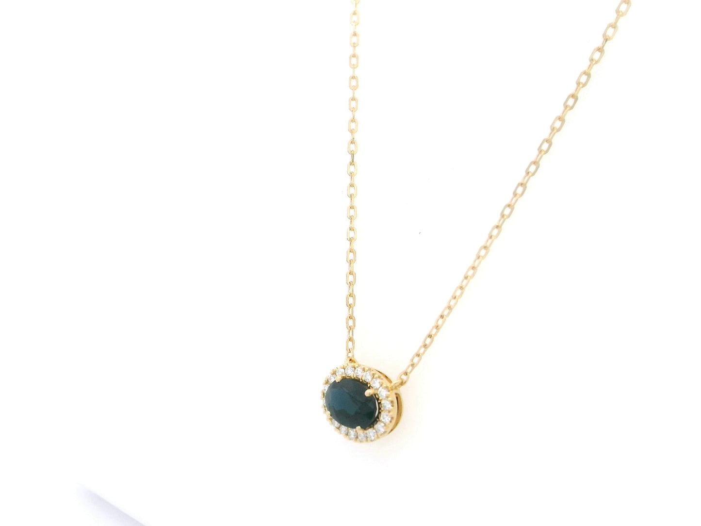 18K yellow gold sapphire and diamond halo pendant necklace with oval blue sapphire center stone
