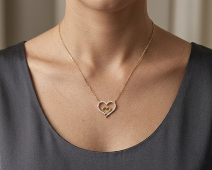 18K yellow gold open heart diamond necklace with pavé diamonds and modern romantic design.