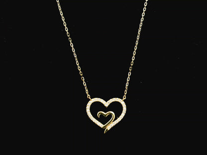 18K yellow gold open heart diamond necklace with pavé diamonds and modern romantic design.