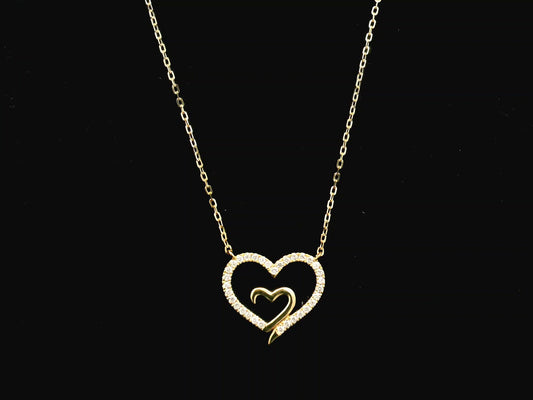 18K yellow gold open heart diamond necklace with pavé diamonds and modern romantic design.