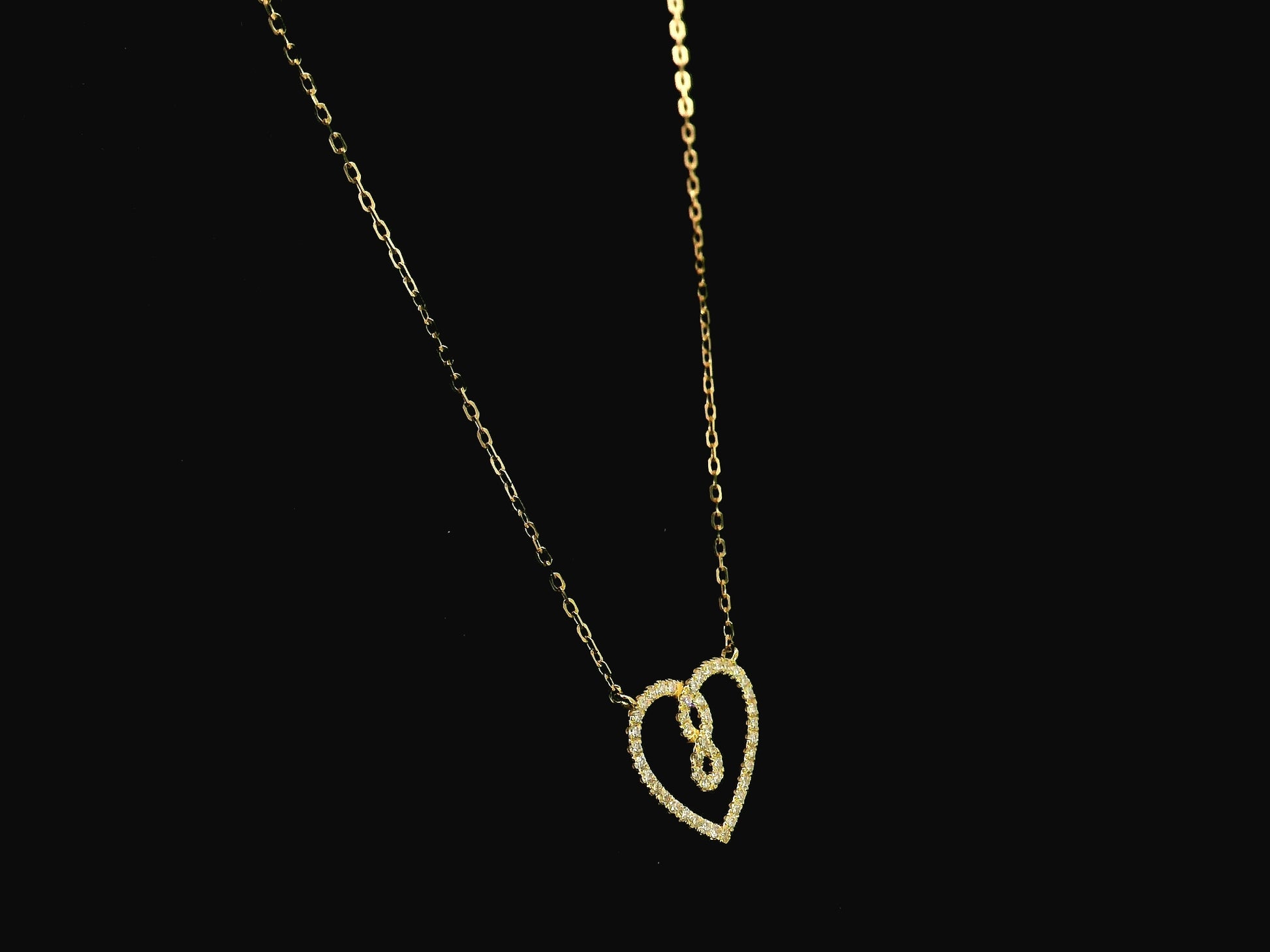 Diamond infinity heart pendant necklace in 18K yellow gold by Emirates Diamonds
