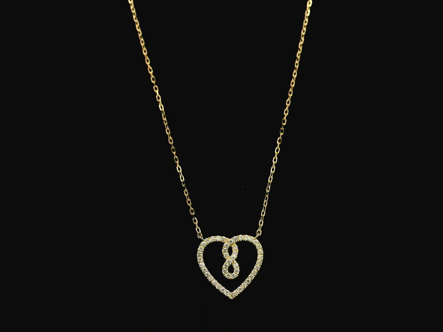 Diamond infinity heart pendant necklace in 18K yellow gold by Emirates Diamonds