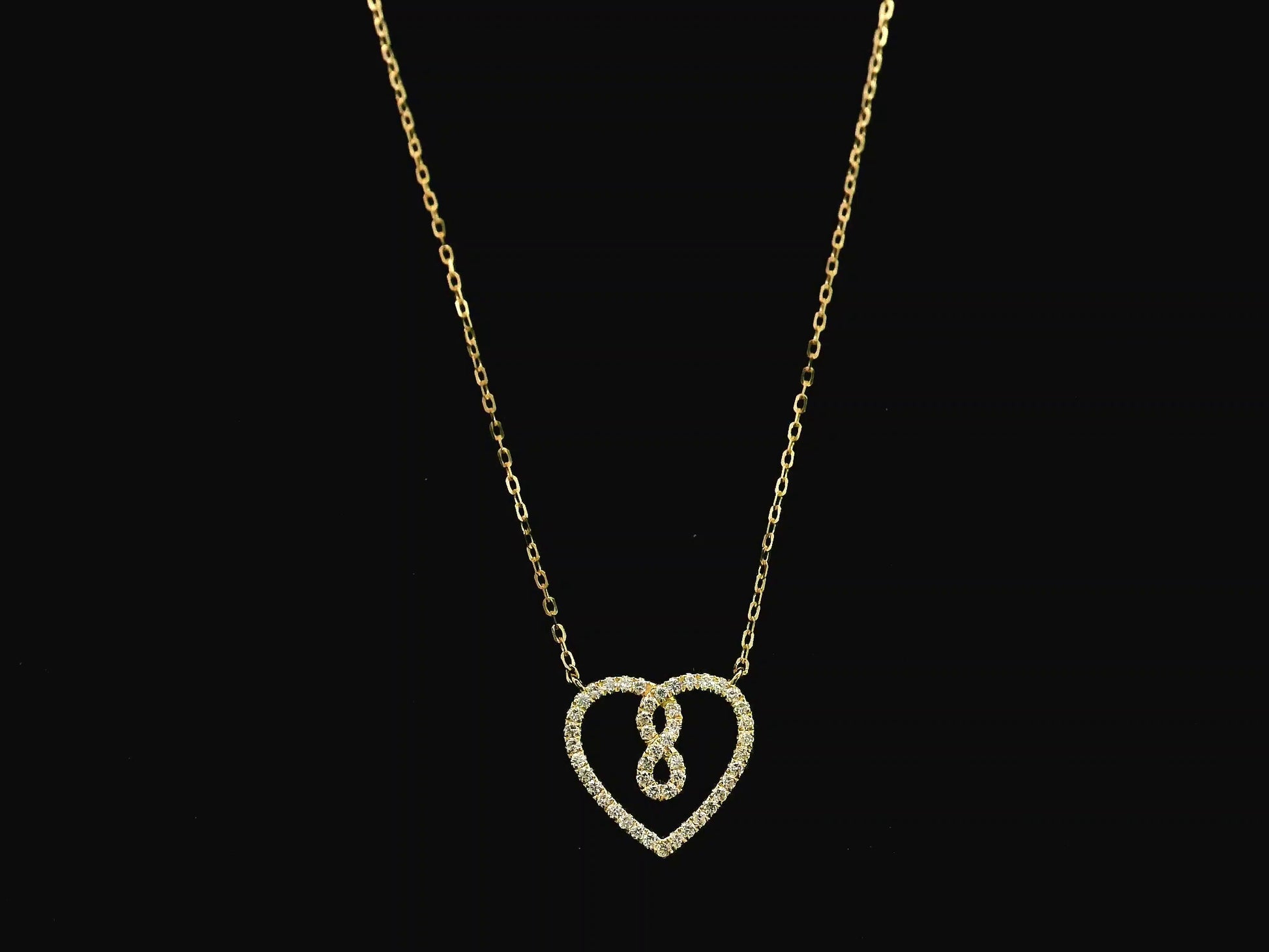 Diamond infinity heart pendant necklace in 18K yellow gold by Emirates Diamonds