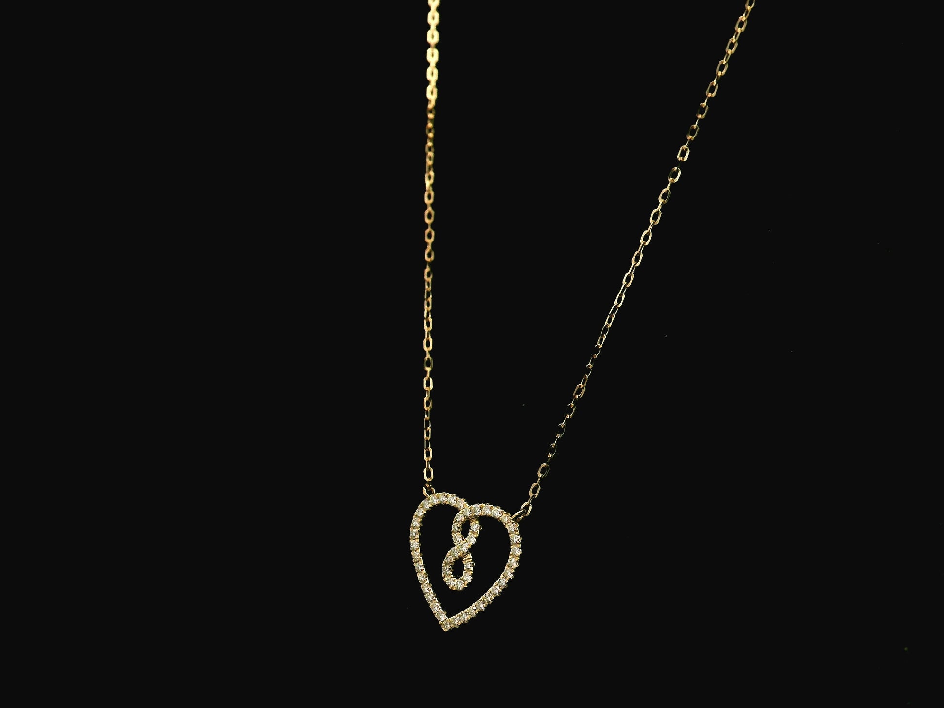 Diamond infinity heart pendant necklace in 18K yellow gold by Emirates Diamonds