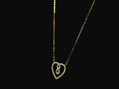 Diamond infinity heart pendant necklace in 18K yellow gold by Emirates Diamonds