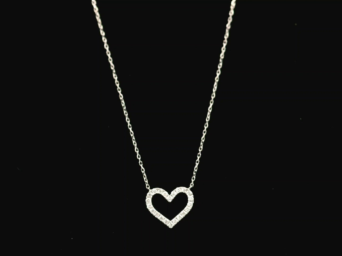 18K white gold open heart diamond necklace featuring 0.20 carat natural diamonds in a delicate pavé setting.